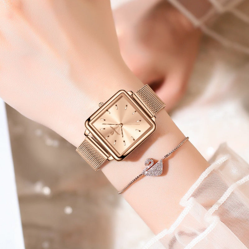 Rose gold square quartz watch with light face and rose gold mesh metal band
