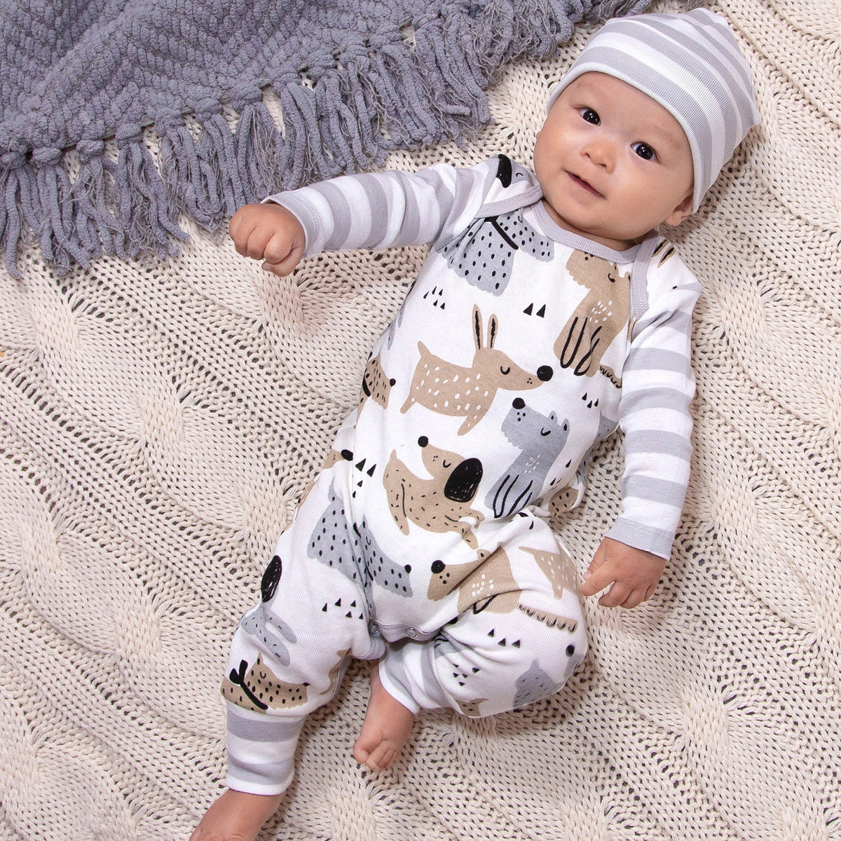 White romper with puppy dog print and gray striped sleeves, front overalls style