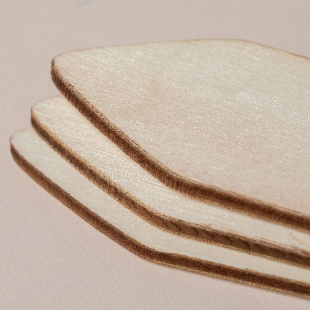 Three curved wooden plant markers