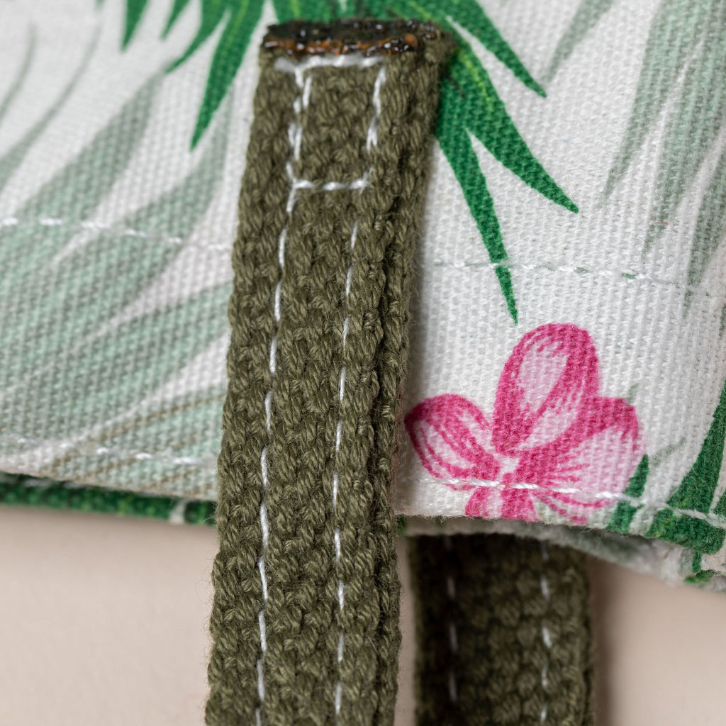 Green woven tote strap with stitched trim and reinforced top loop