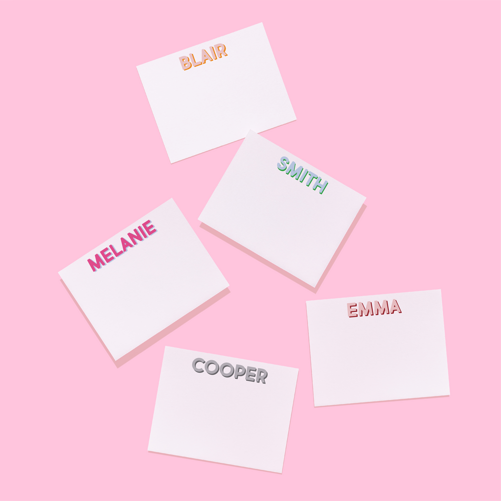 Personalized stationery set of name cards with “BLAIR,” “MELANIE,” “SMITH,” “EMMA”
