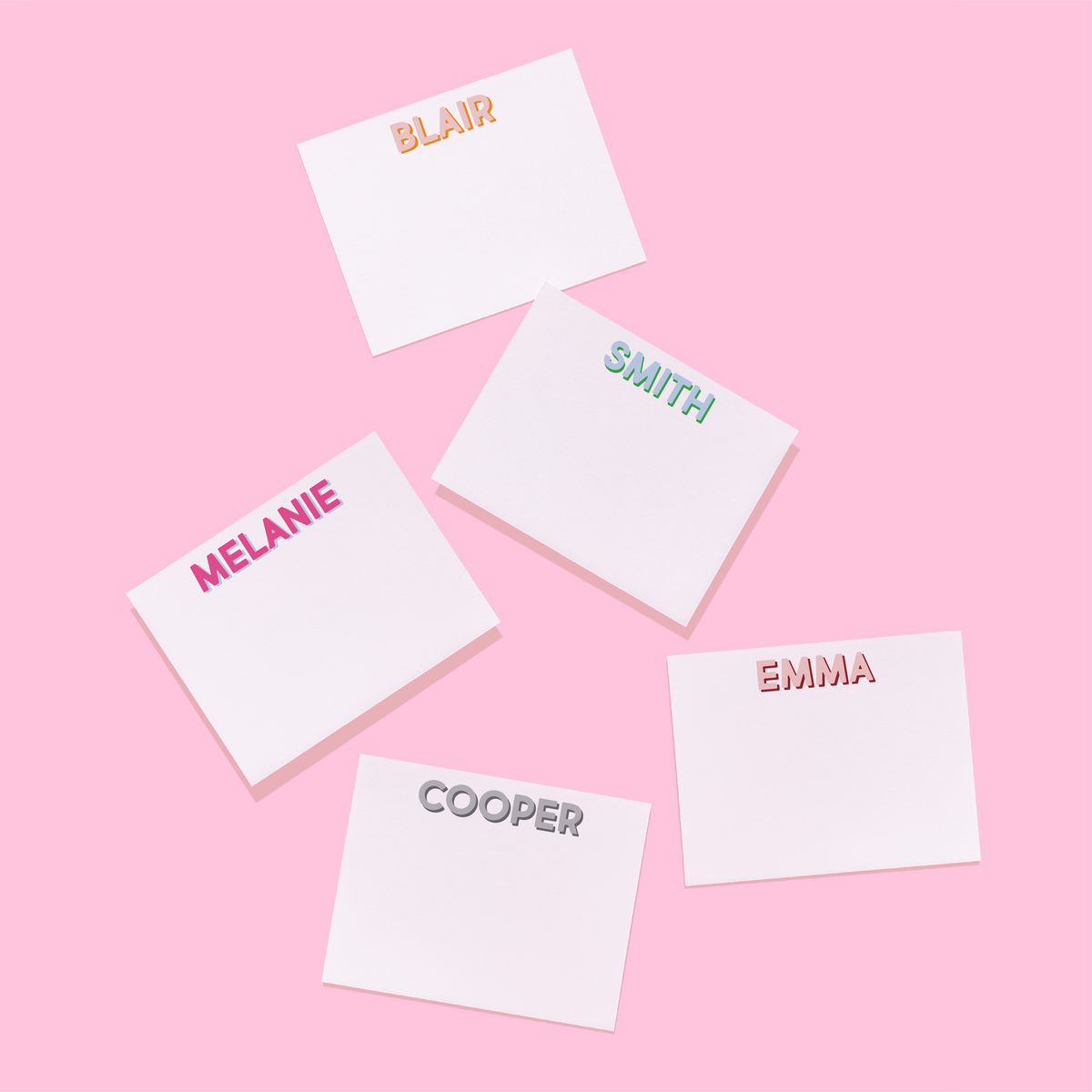 Personalized stationery set of name cards with “BLAIR,” “MELANIE,” “SMITH,” “EMMA”