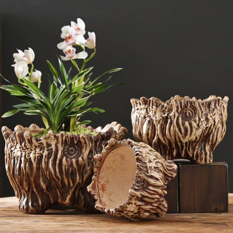 Large ceramic flower pot with tree-root carved texture and scalloped opening
