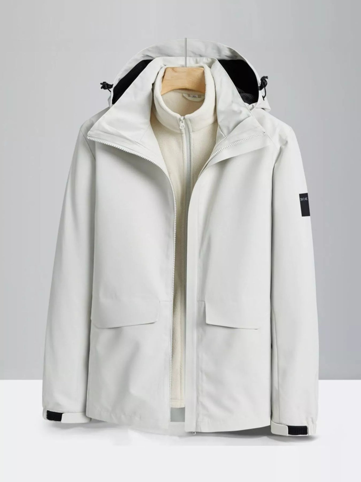 White zip-up hooded waterproof jacket with front pockets