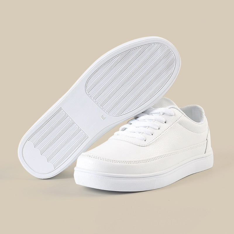 White lace-up sneakers with textured outsole and sidewall detail