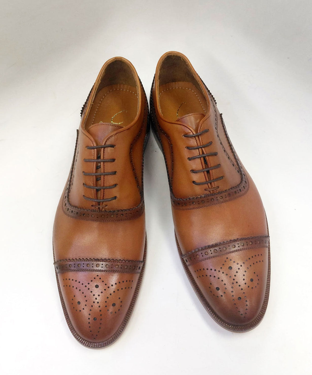 Cognac calfskin oxford shoes with brogue detailing and lace-up front
