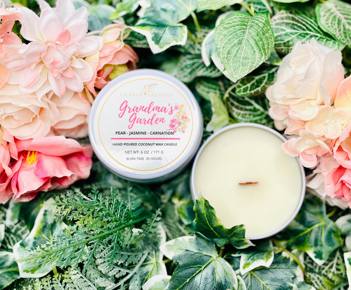 Cream wax wood wick candle labeled Gardner's Garden in round tin