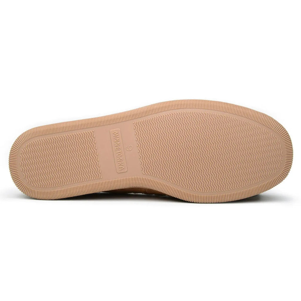 Men's tan moc slipper outsole with textured rubber tread and logo label