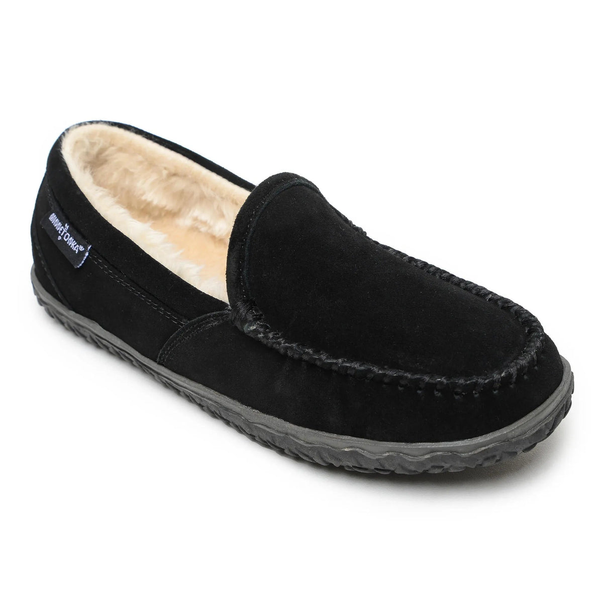 Black suede slip-on slippers with faux fur lining and contrast stitched edges