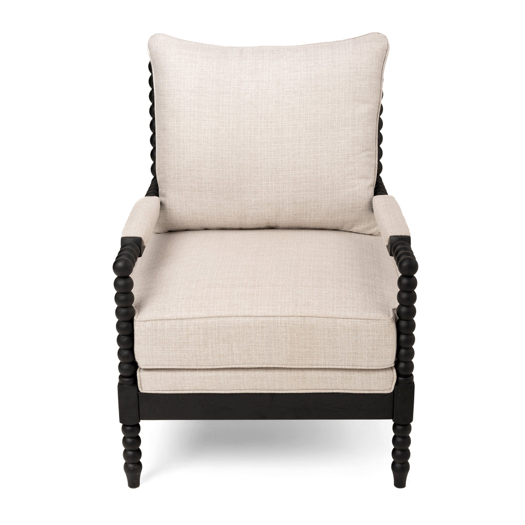Front view of a cream upholstered accent chair with a black beaded frame