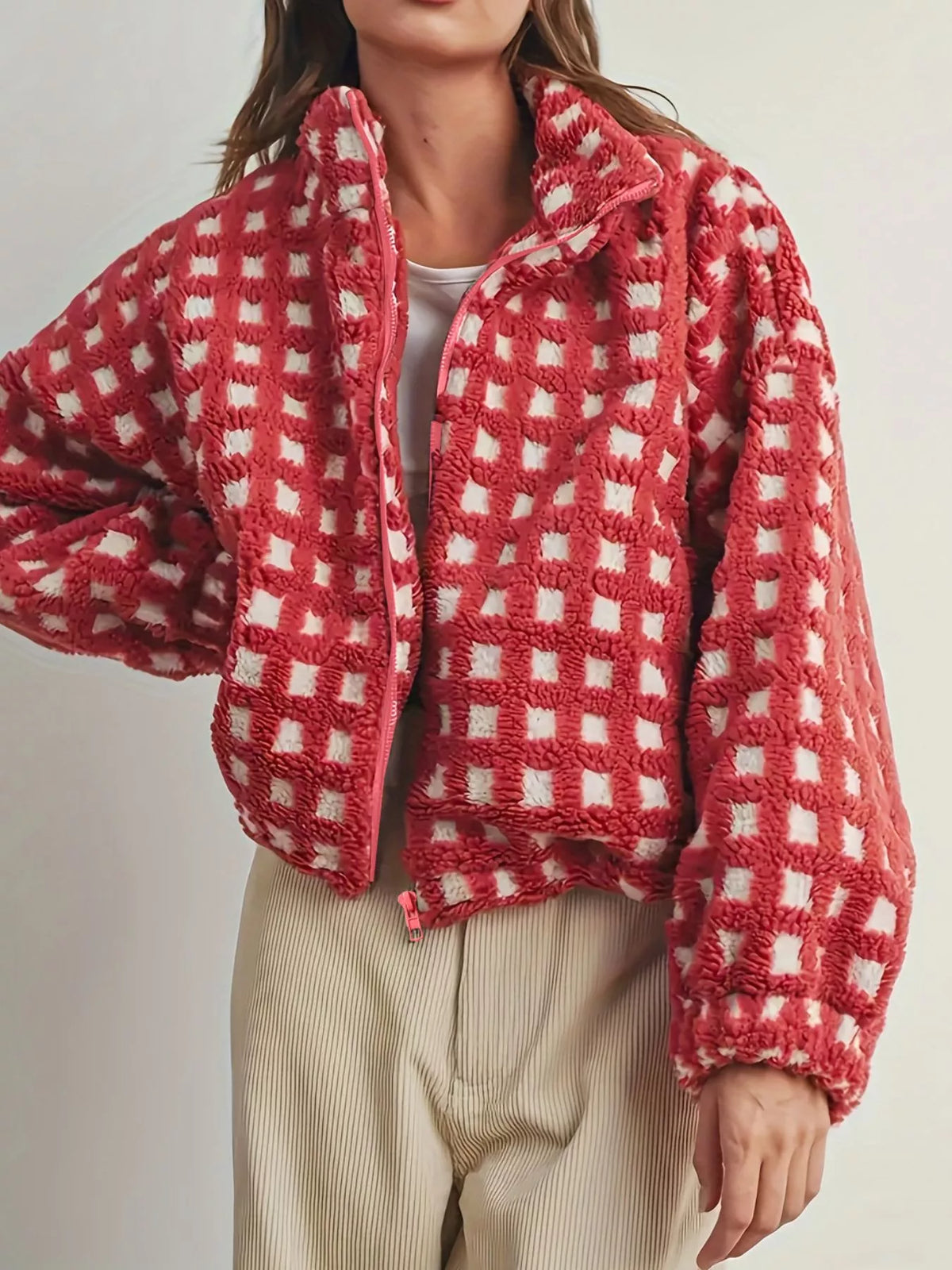 Red plaid sherpa zip-up jacket with front zipper placket and fuzzy fleece finish
