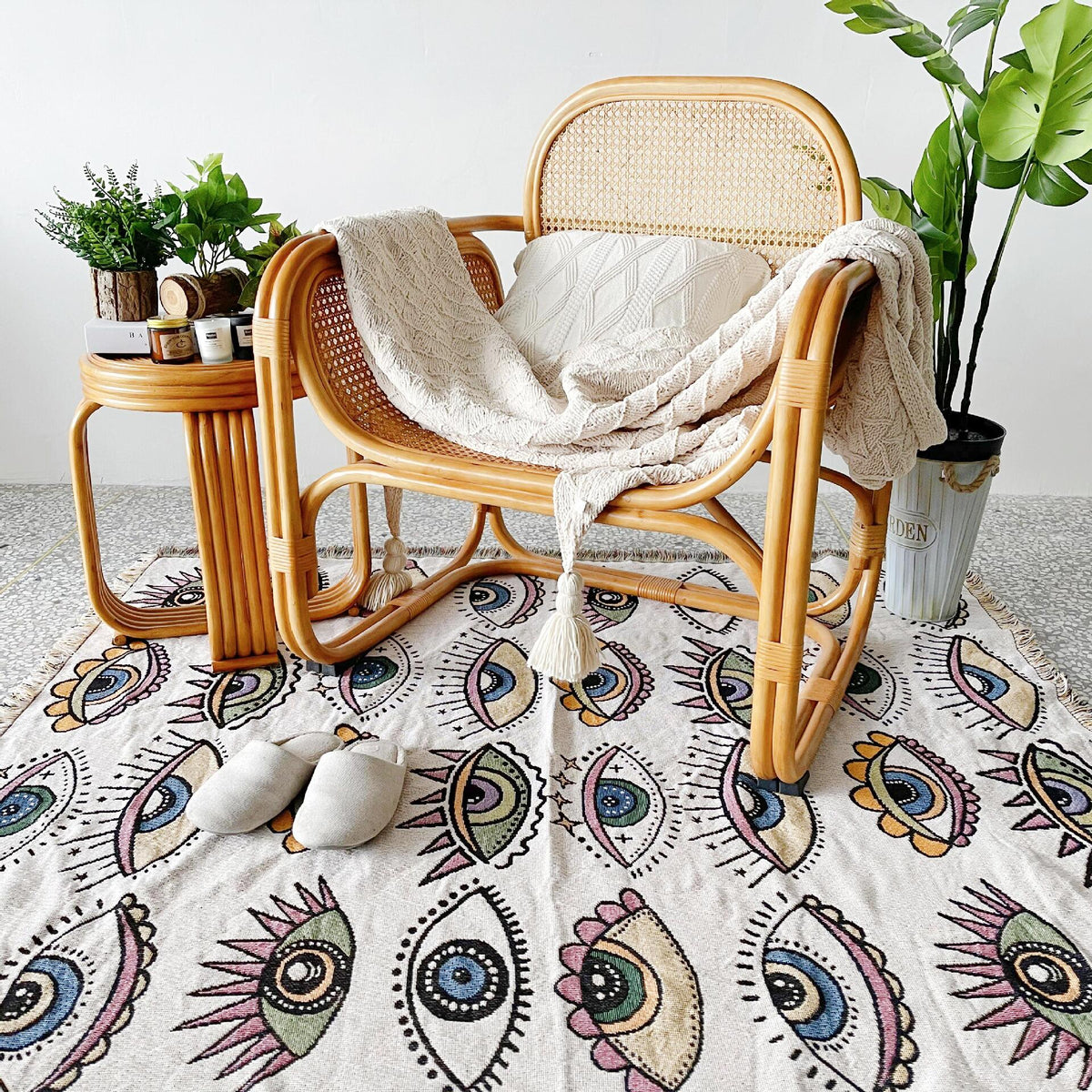 Evil eye beach blanket with multicolor eye print and fringed border
