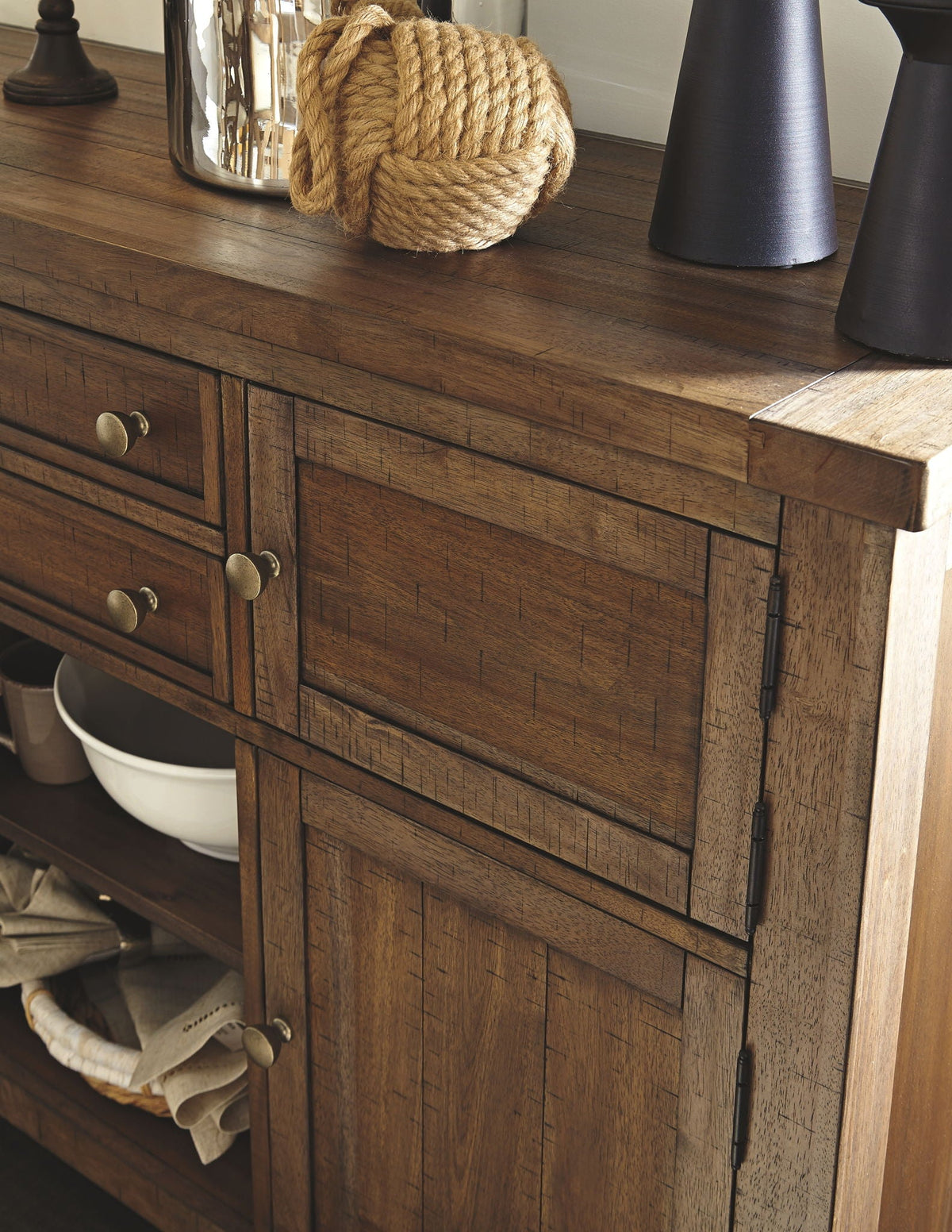 Dark brown server cabinet with wood drawers and metal pulls