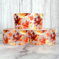 Transparent bottle boot sleeve with orange and red fall leaf print, two rolls
