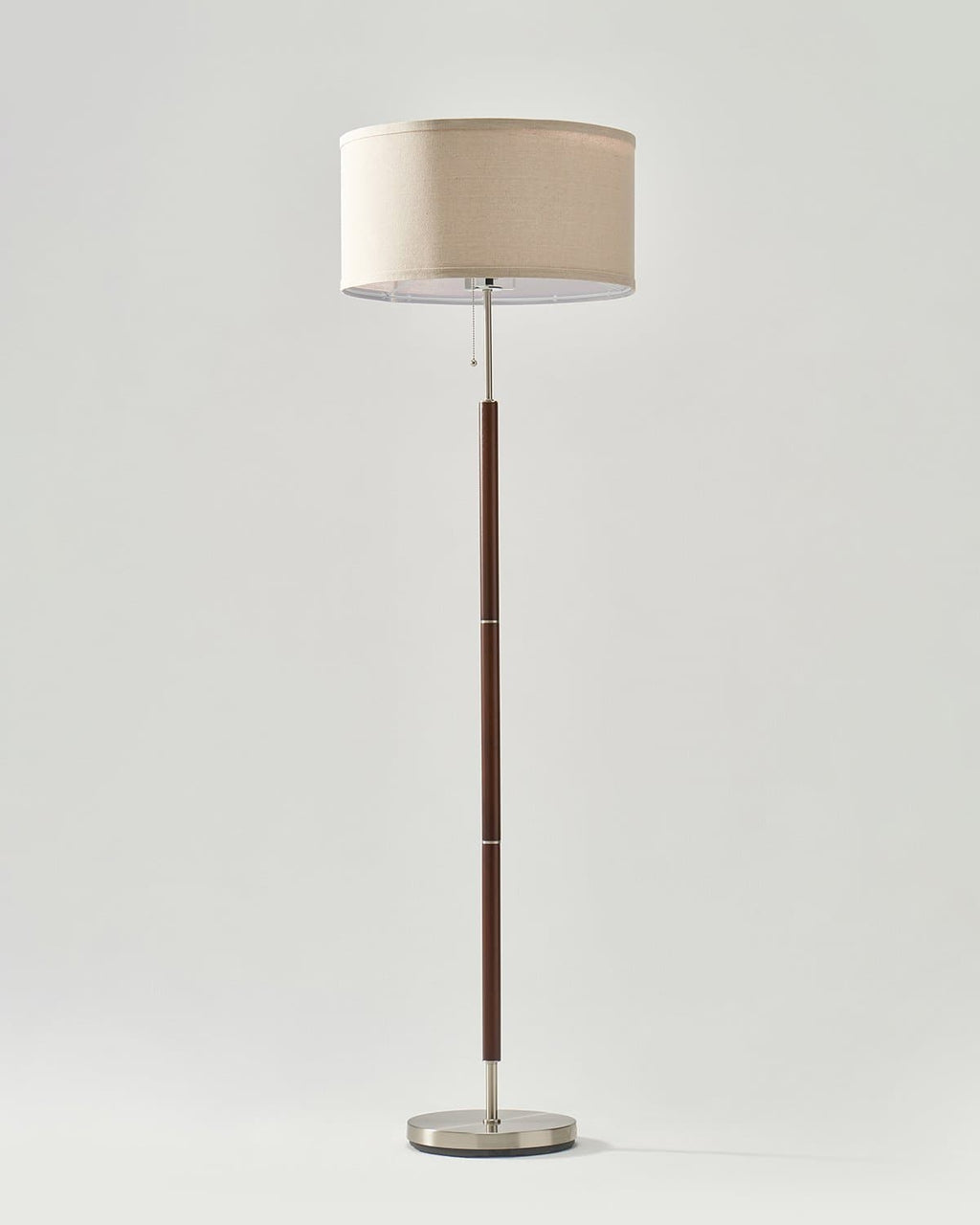 Carter floor lamp with beige drum shade, dark bronze pole, round metal base