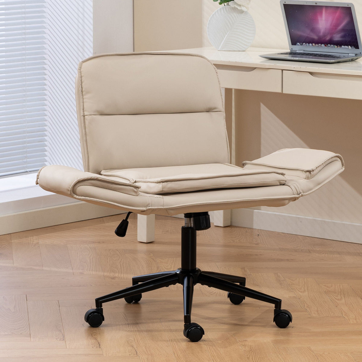 Beige fabric swivel desk chair with padded backrest, curved armrests, and caster wheels