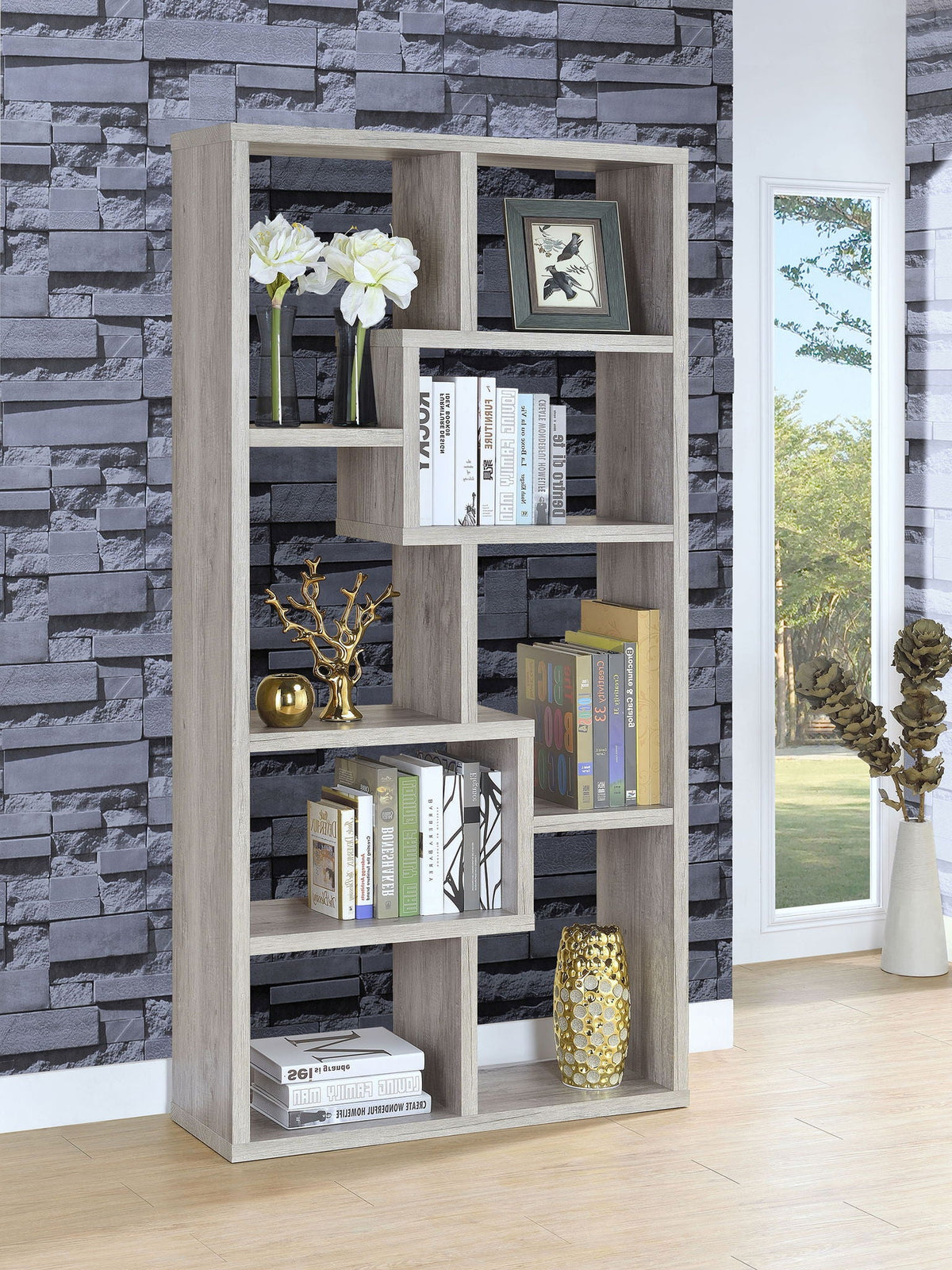 Grey driftwood bookcase with open shelves holding books and decor, 6-cubby layout