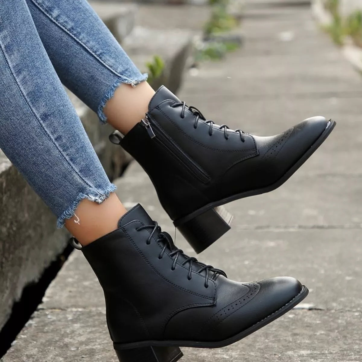 Black lace-up ankle boots with side zipper and low block heel, lace-up front
