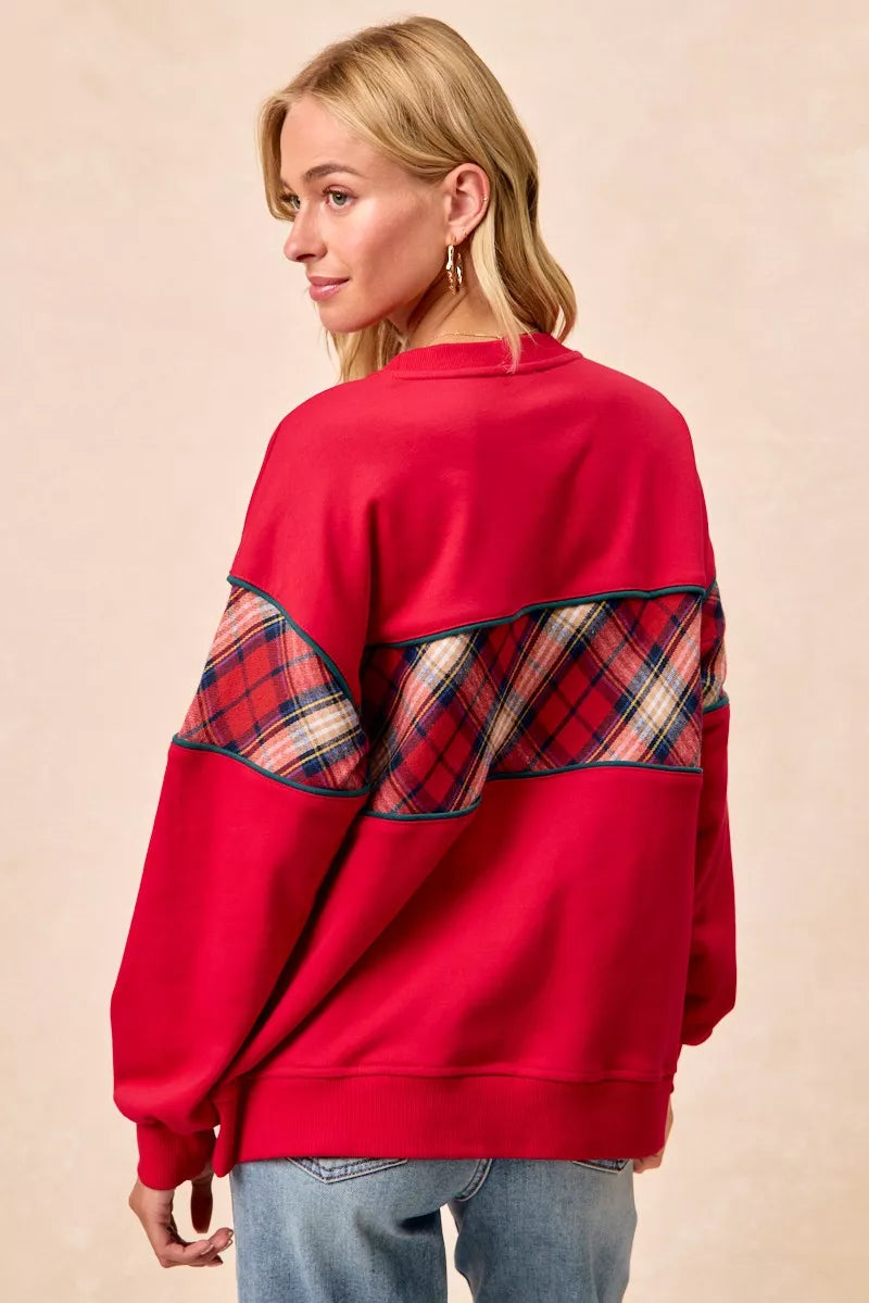 Red sweatshirt back with plaid band across upper back and teal trim, long sleeves