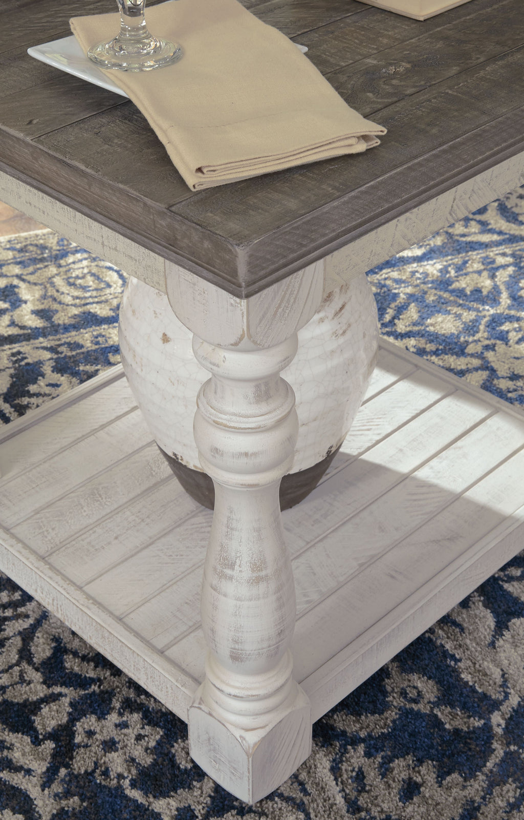 Gray rectangular end table with lower shelf and turned white legs
