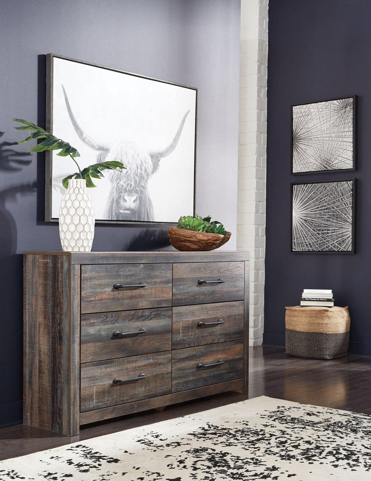 Weathered wood dresser with six drawers and metal bar pulls