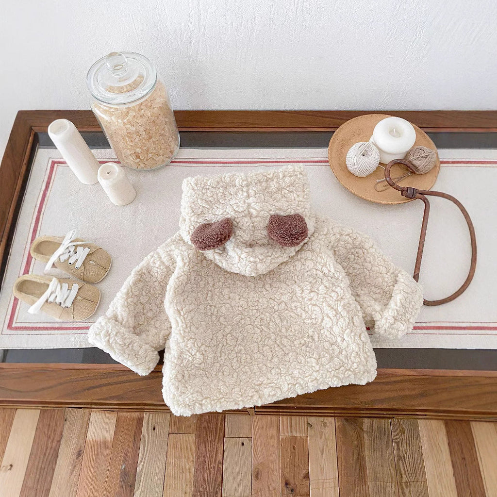 Cream teddy-fleece toddler coat with bear ears and front snap pockets
