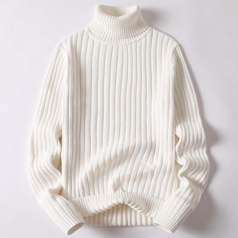 White ribbed turtleneck sweater with long sleeves and thick knit collar.