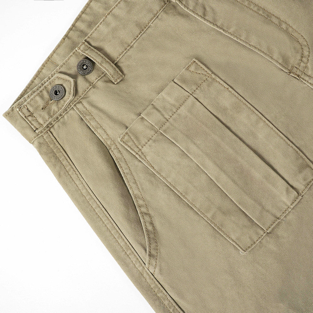 Khaki work pants close-up of button waistband and patch pocket