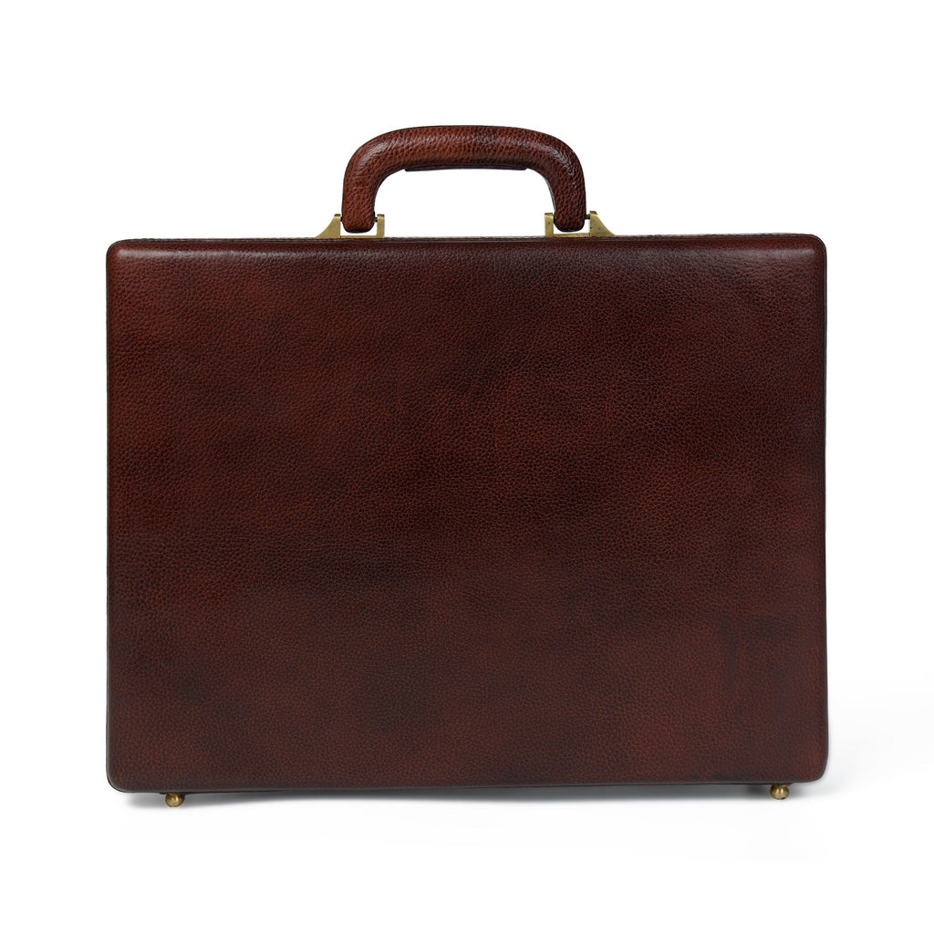 Rich brown leather office suitcase back view with carry handle and brass feet