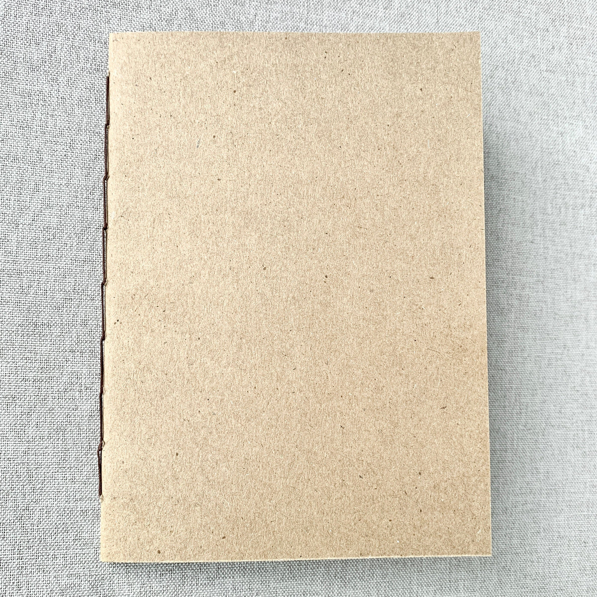 A5 kraft cover notebook insert with plain back and stitched edge detail