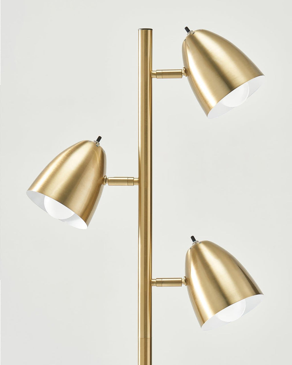 Brass floor lamp with four cone light shades facing different directions