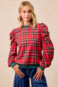 Red plaid top with exaggerated shoulder puff sleeves and green neckline cuffs