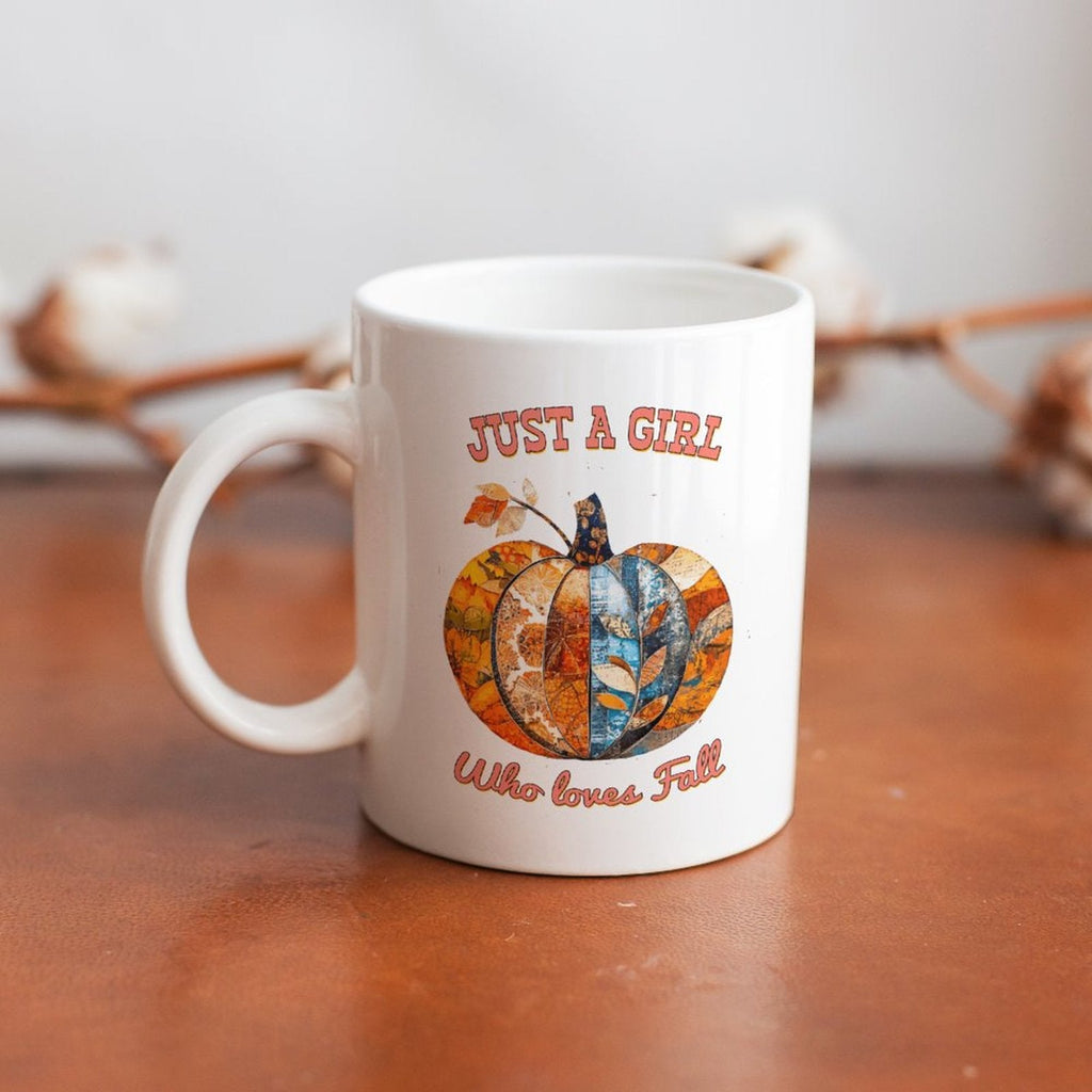 White ceramic mug with handle, pumpkin graphic and 'Who loves Fall' text