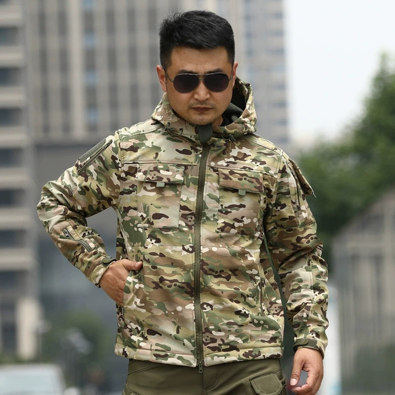 Camouflage tactical shell jacket with stand collar and zip-front utility pockets.
