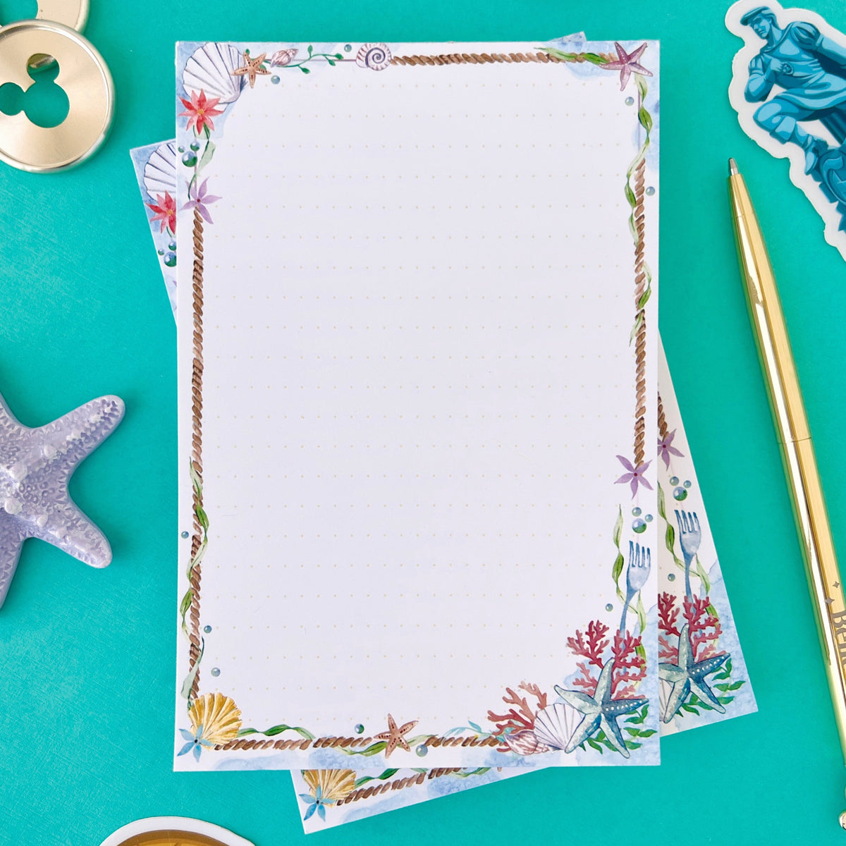 Sea-themed memo notepad page with dotted writing area and braided border