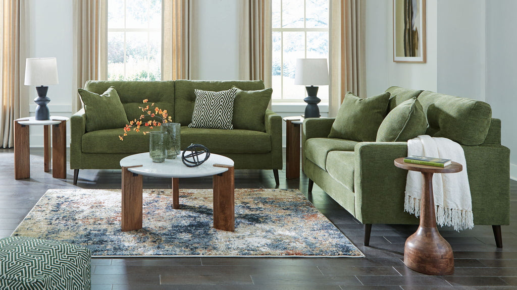 Green fabric sofa and loveseat set with squared arms and dark tapered legs