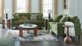 Green fabric sofa and loveseat set with squared arms and dark tapered legs