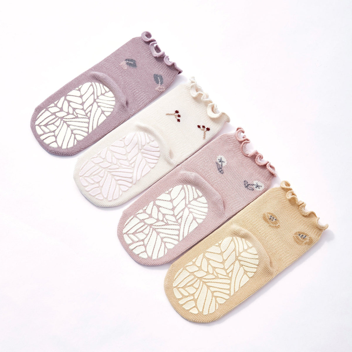 Set of 4 baby non-slip socks with ruffled cuffs: mauve, cream, pink, and yellow