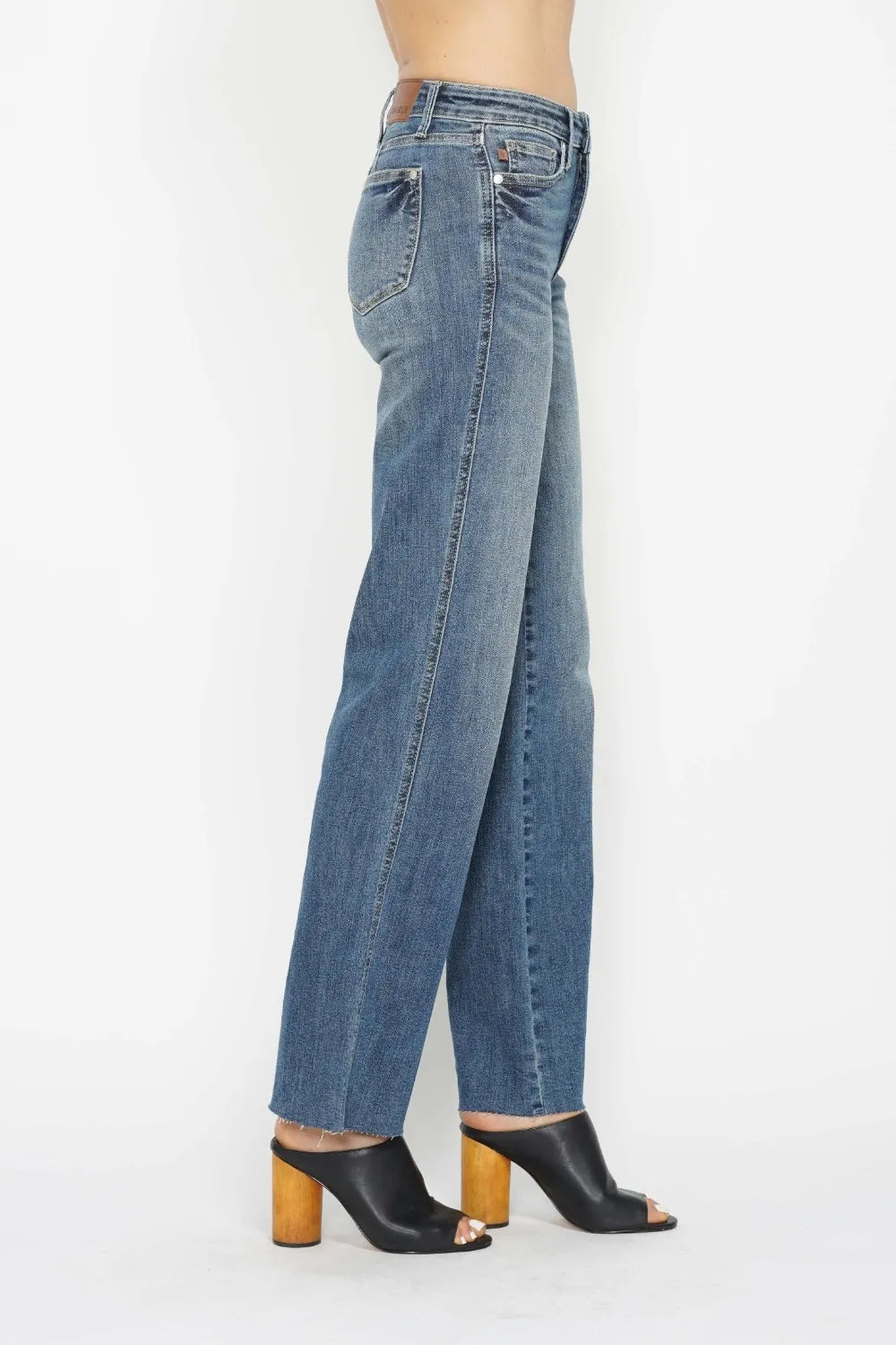 Medium-wash straight-leg jeans, three-quarter back view with patch pockets