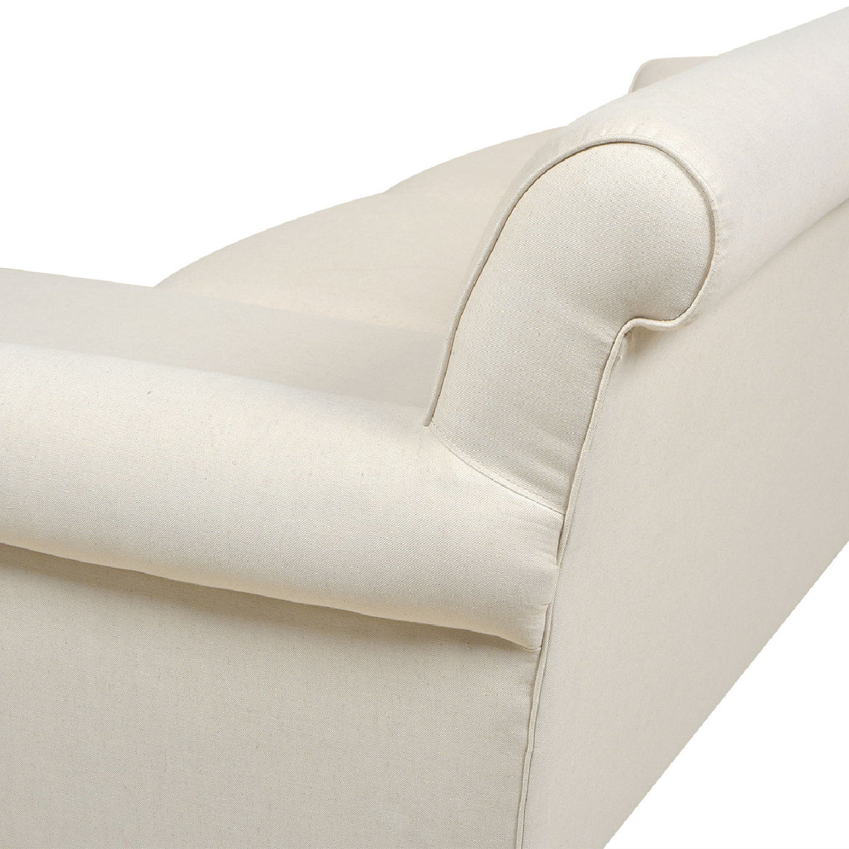 Light beige sofa cushion and rounded corner arm with visible stitching