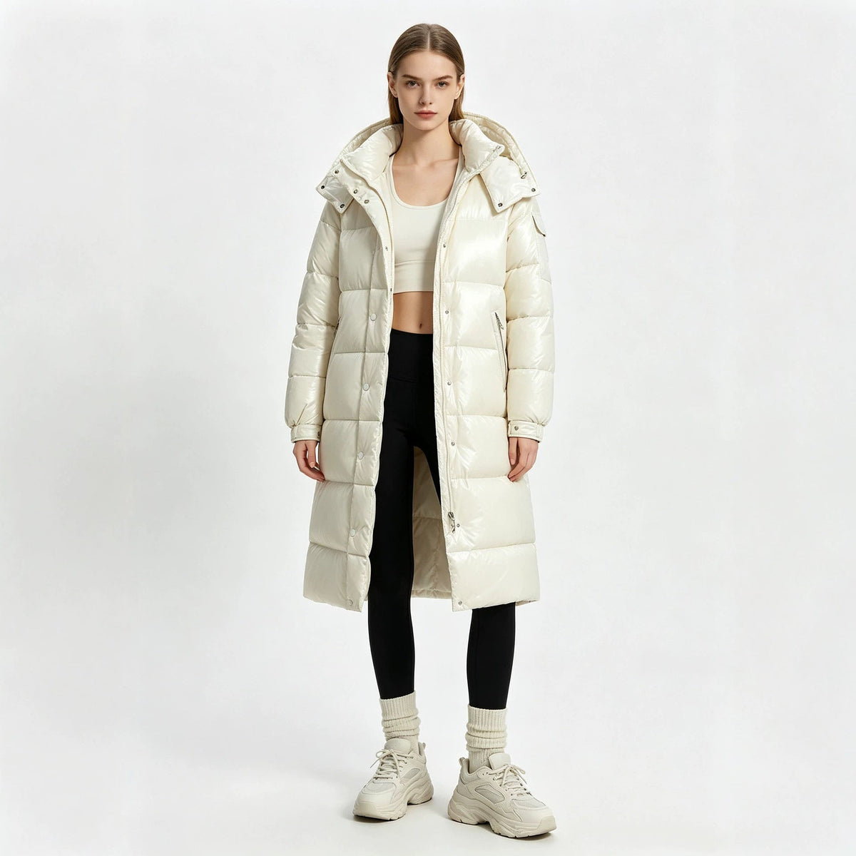 Cream long padded hooded coat with front zipper and quilted puffer panels, over-the-knee