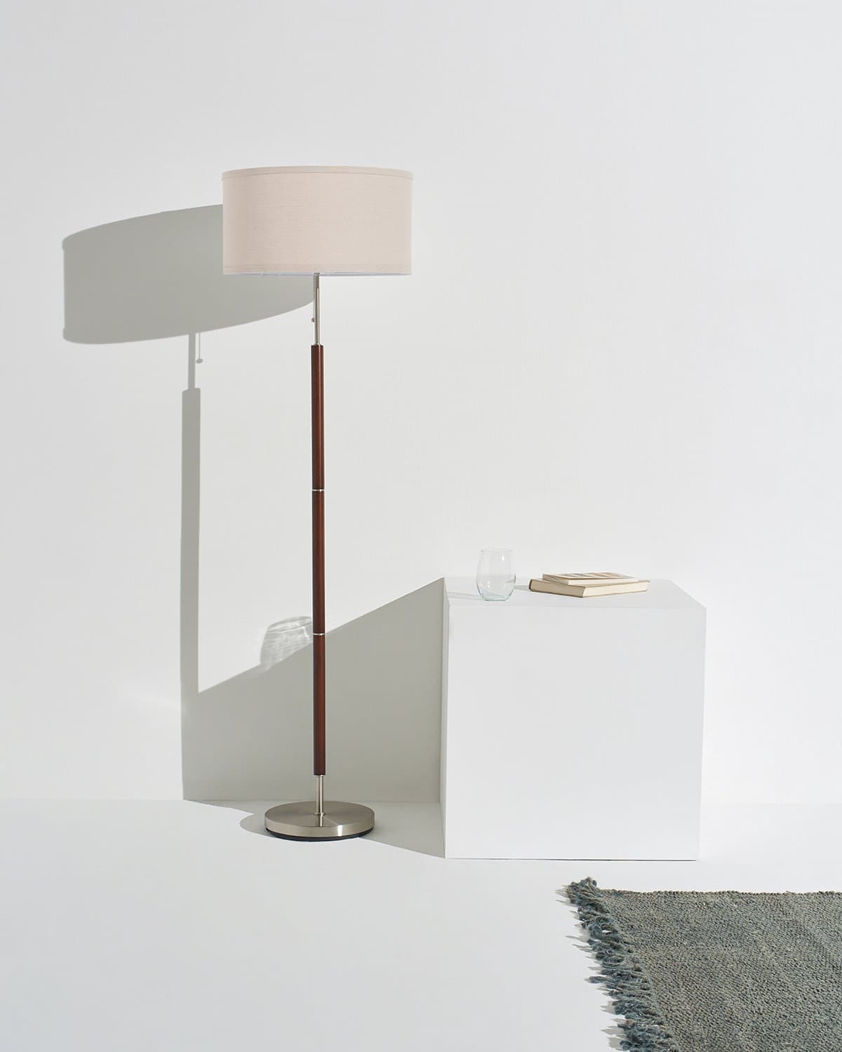 Carter floor lamp with beige drum shade and dark bronze pole with round base