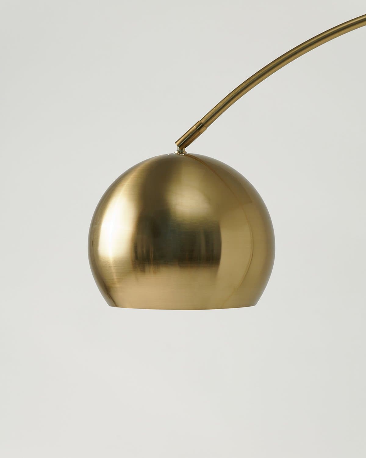 Gold-tone dome lamp head with arched arm attachment