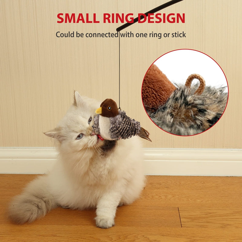Cat playing with plush bird toy with brown head, yellow beak, and feathered wings