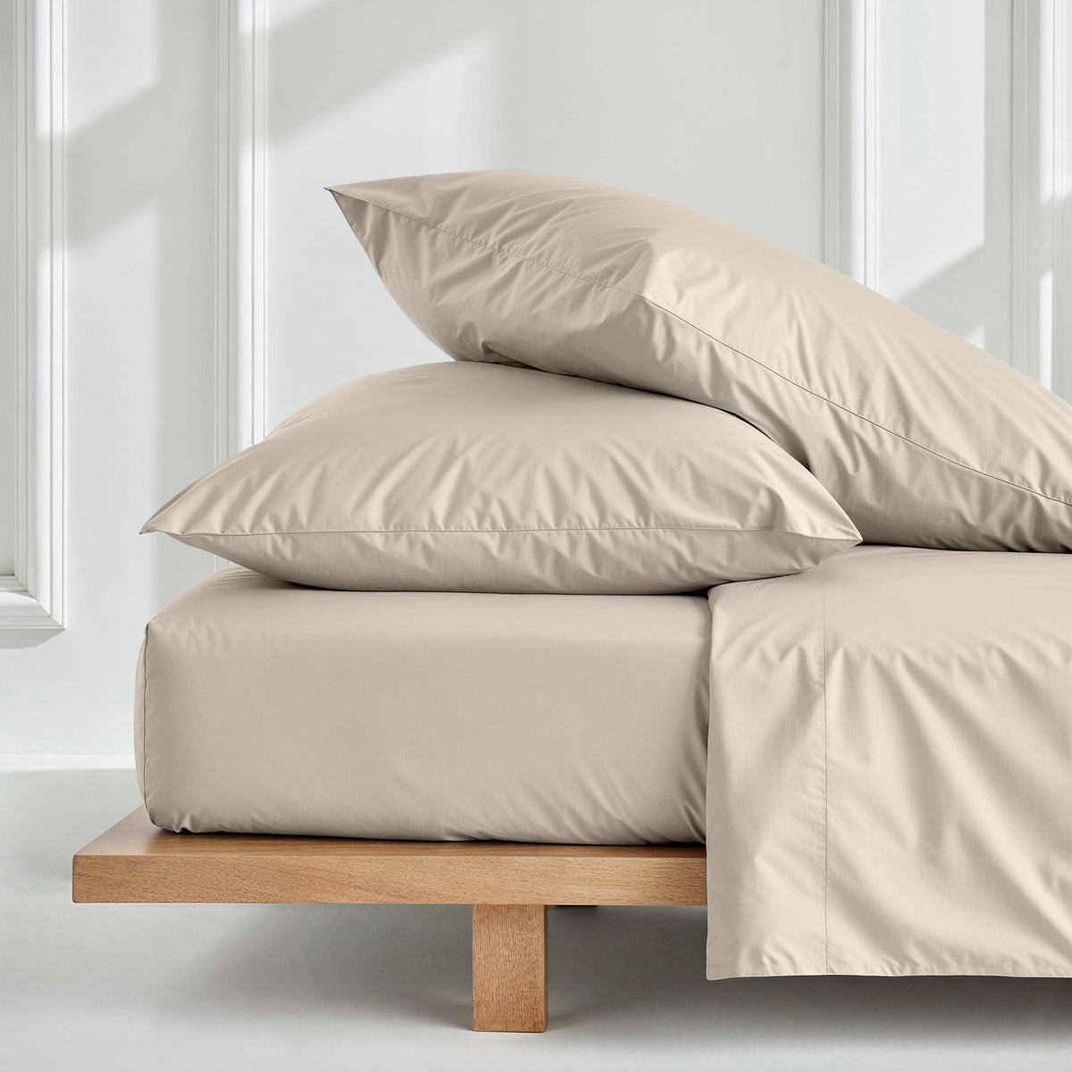 Ecru solid sateen sheet set with fitted sheet and two matching pillowcases