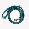 Teal braided rope dog leash with round metal clip and adjustable end strap