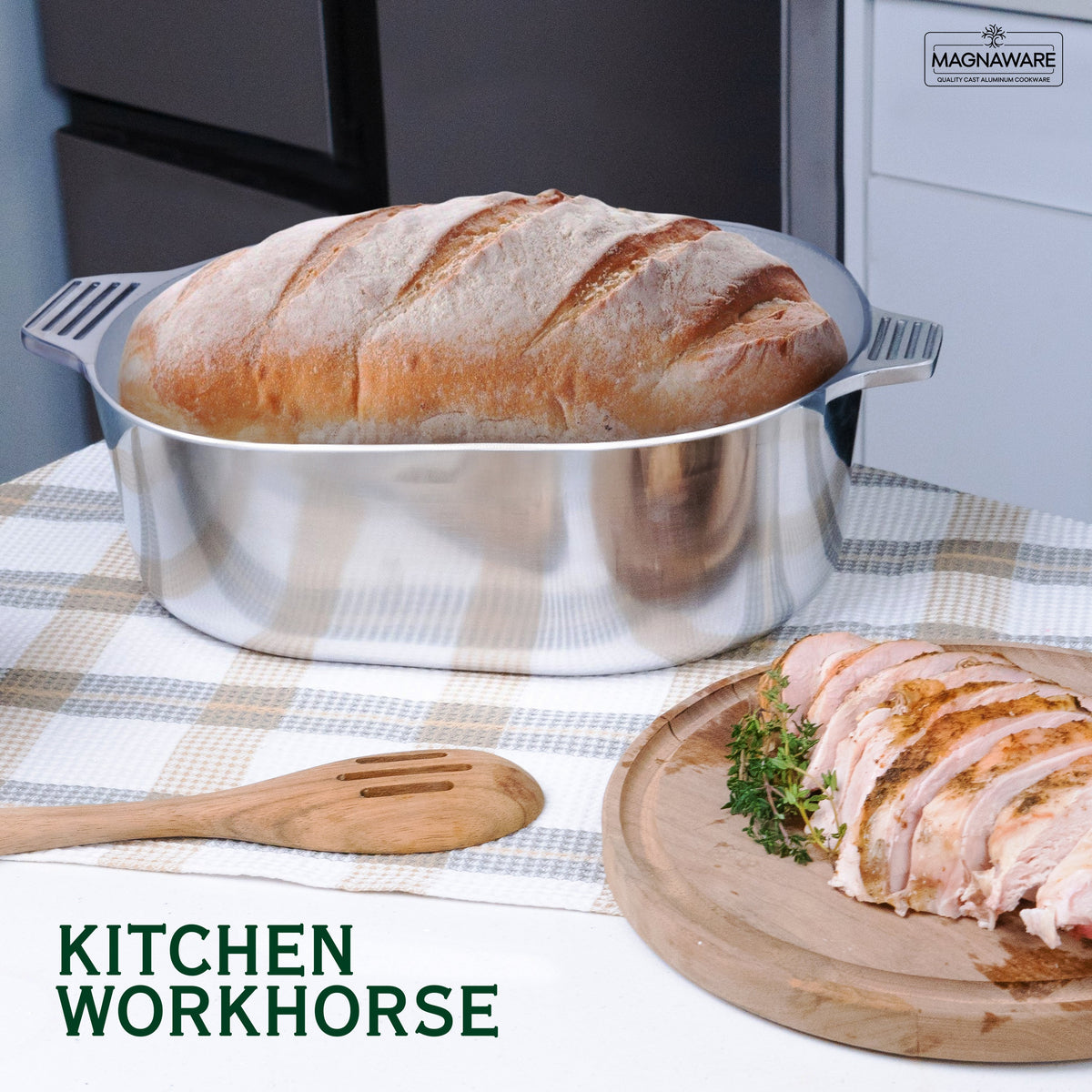 Stainless oval Dutch oven with domed lid on countertop