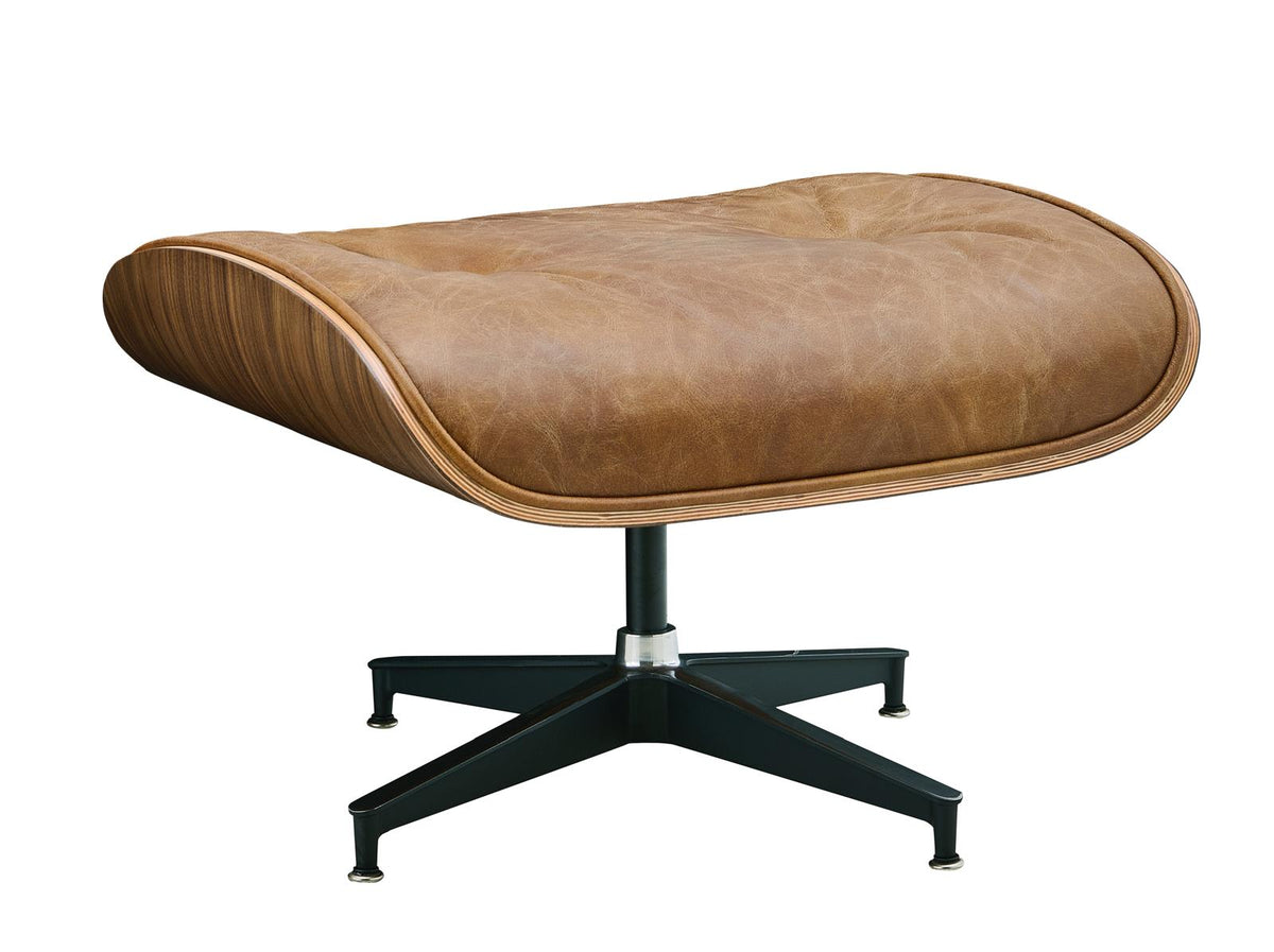 Tan leather ottoman with arched edges and black star-shaped swivel base