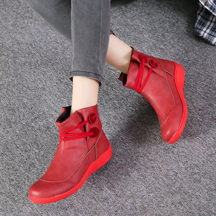 Scarlet lace-up ankle boots with side button detail, worn with cuffed jeans