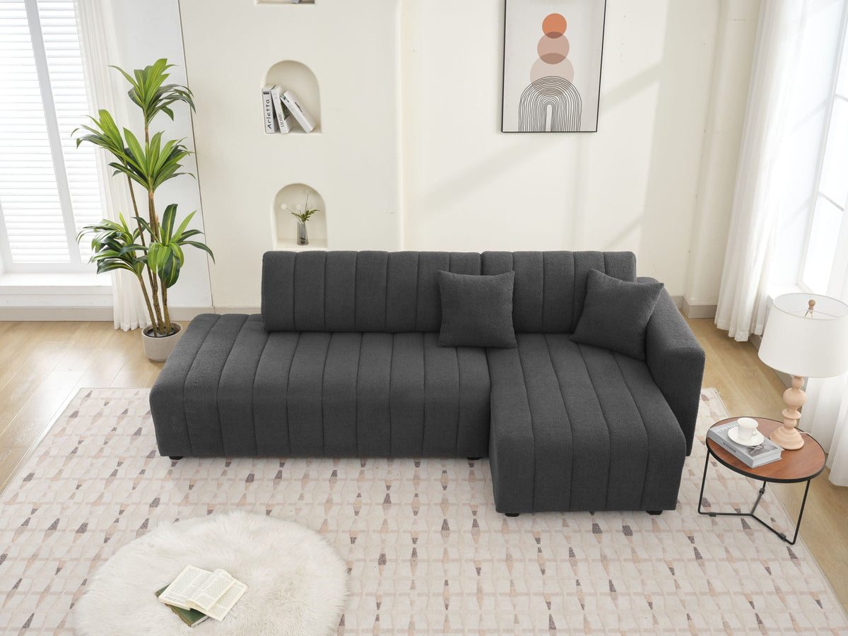 Dark gray sectional sofa with chaise, deep cushions and vertical channel-stitch back
